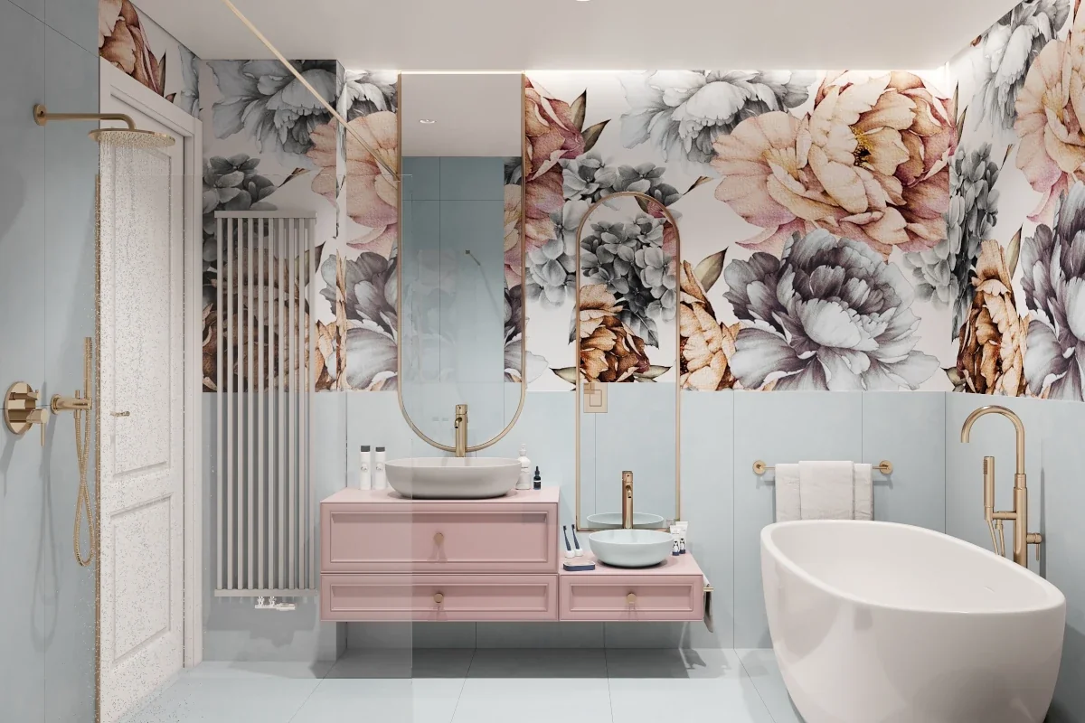 Łazienka w połącznie błękitu oraz motywów kwiatowych. Meble w łazience są koloru różowego.
