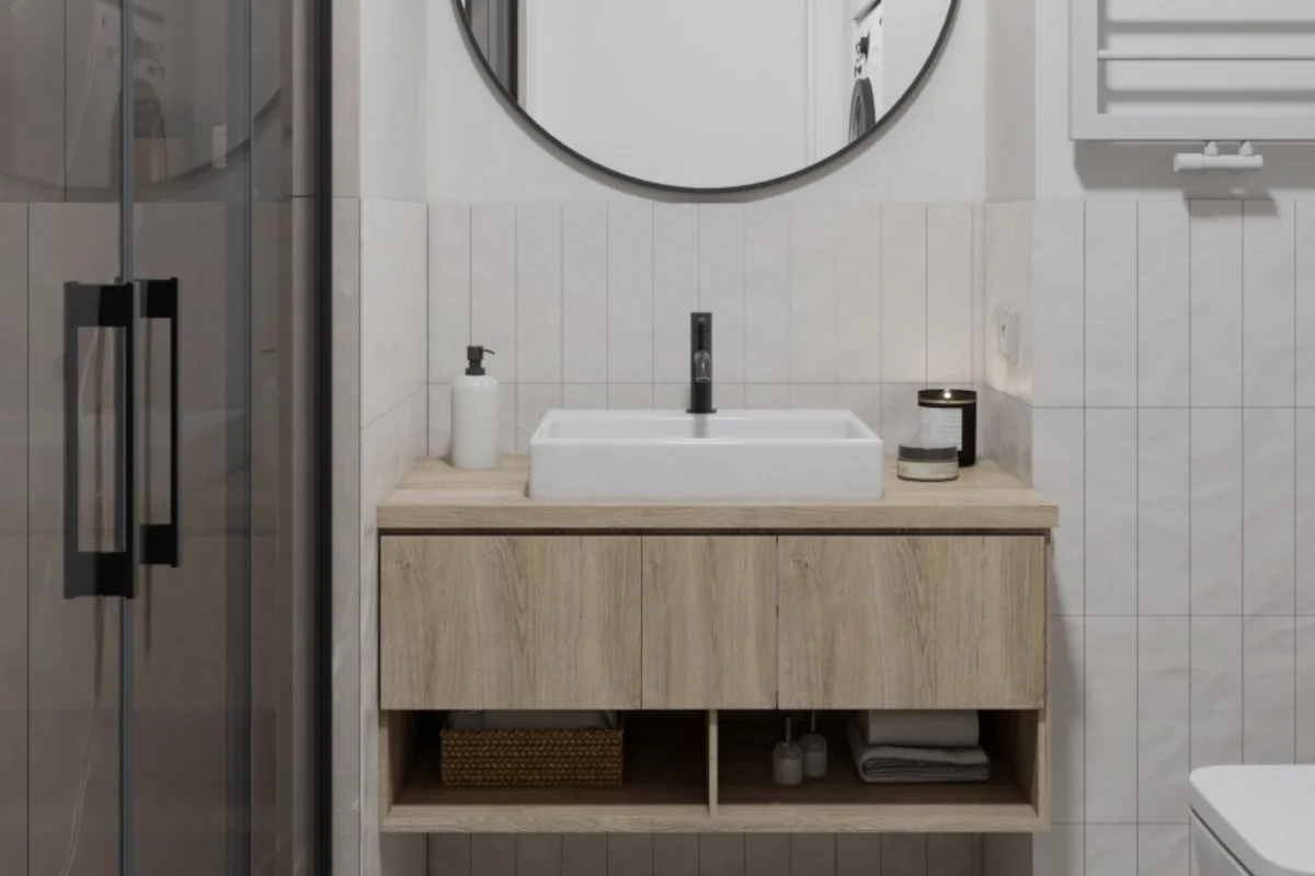 Łazienka z kabina prysznicowa obok szafki pod umywalkę w kolorze drewna/